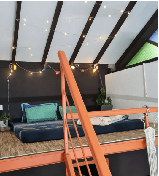 Loft Room alternate bed view — cosy double bed, heritage villa interior